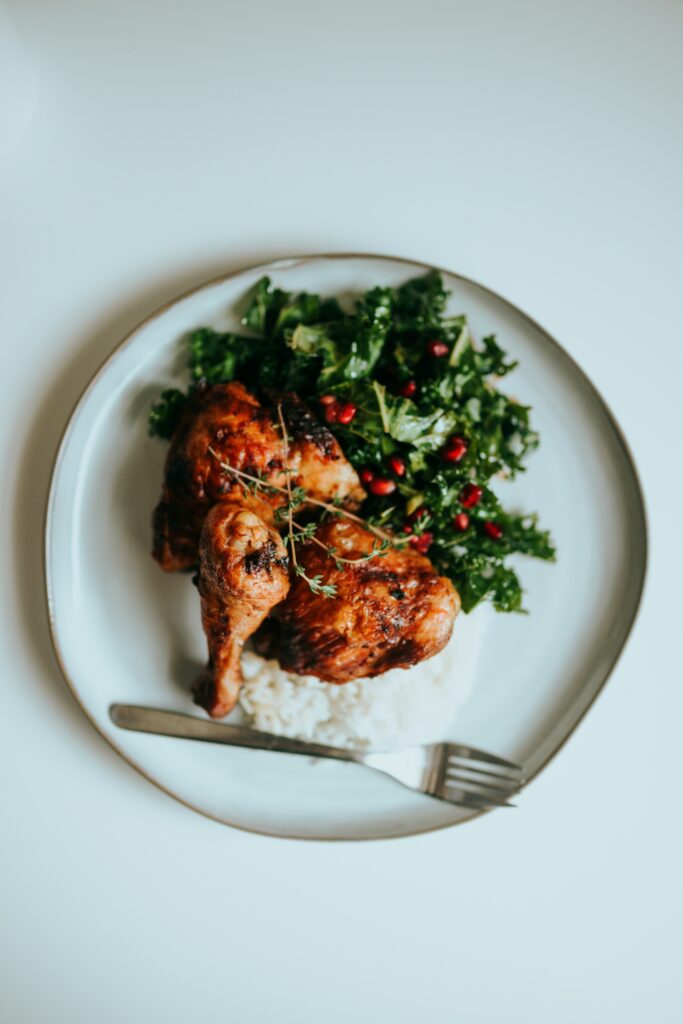 A high-protein meal featuring grilled chicken breast, quinoa, and vegetables