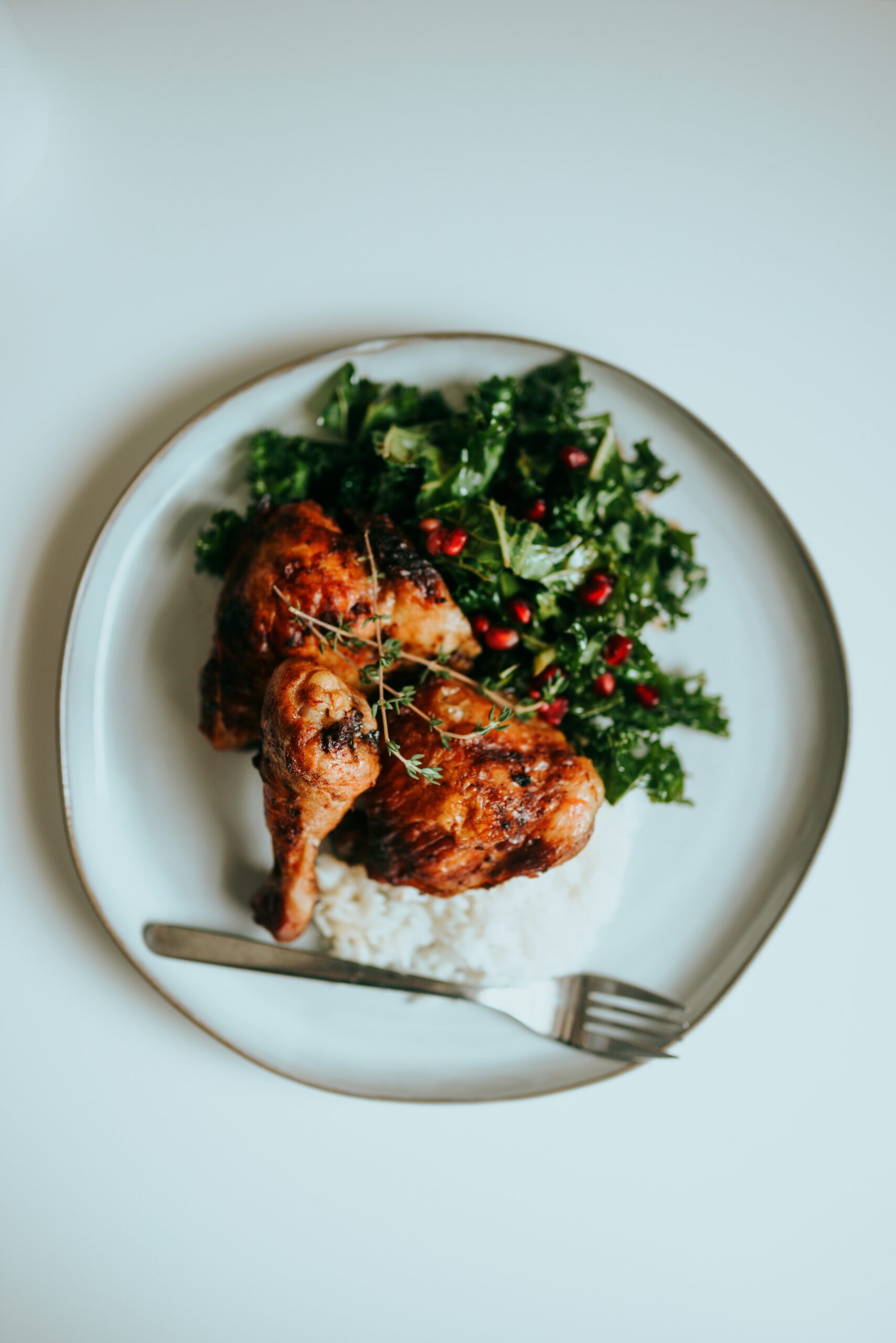 A high-protein meal featuring grilled chicken breast, quinoa, and vegetables
